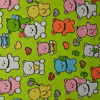 GRÖN BOMULLSPOPLIN MED KAWAII NALLEMÖNSTER