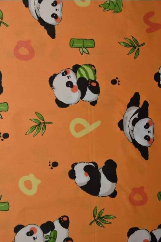 Orange bomullspoplin med pandatryck – barn (bild 1 av 3)