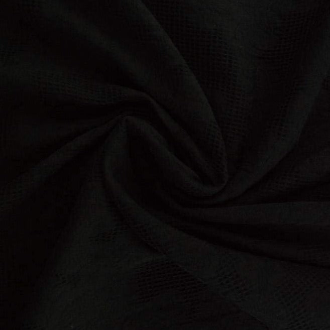 Svart bomulls jacquard – våffelstruktur med blommotiv (bild 1 av 5)