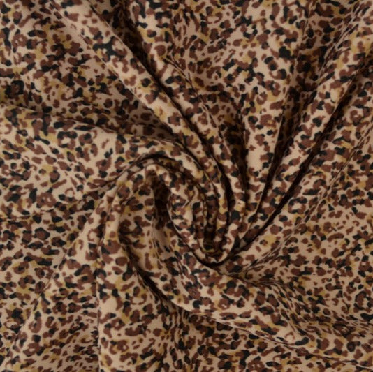 Beige lycra tyg för badkläder och sportkläder med leopardmönster (bild 1 av 3)
