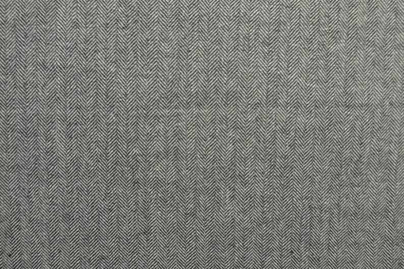 Grå ull/polyester tyg med tweedstruktur och sillbensmönster (bild 3 av 3)