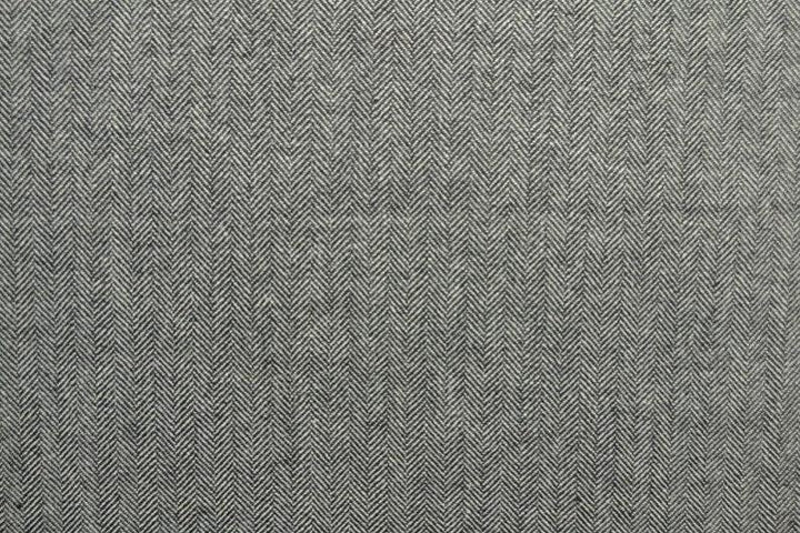 Grå ull/polyester tyg med tweedstruktur och sillbensmönster (bild 3 av 3)