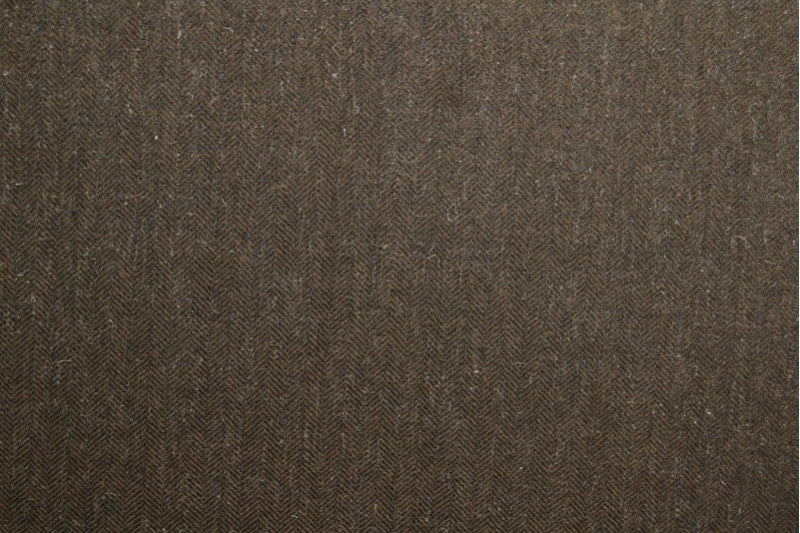 Brun ull/polyester tyg med tweedstruktur och sillbensmönster (bild 3 av 3)